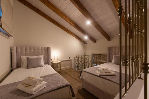 Posteľ alebo postele v izbe v ubytovaní Capolavoro Suites