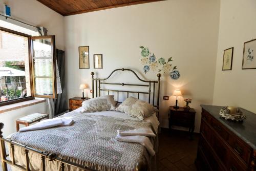 Säng eller sängar i ett rum på Appartamento Vecchio Mulino