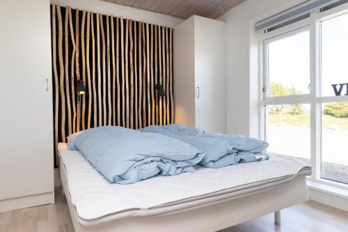 Postel nebo postele na pokoji v ubytování Havrevang, Ferielejligheder