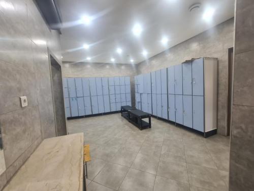 a large room with a row of baseball stalls at Targafit Hotel & Hammam in Marrakech