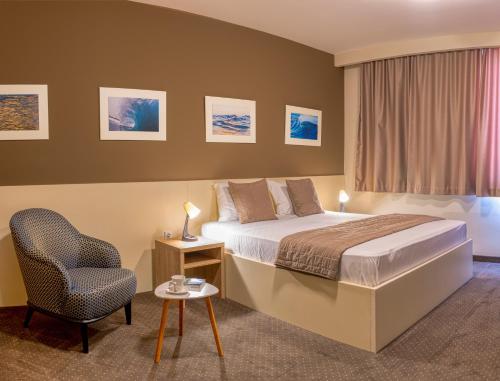 Hotel Argentum tesisinde bir odada yatak veya yataklar