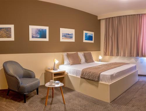 Postel nebo postele na pokoji v ubytování Hotel Argentum