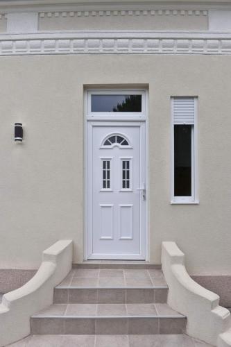 a white door on the side of a house at 4-teen in Jagodina