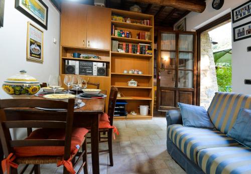 a living room with a table and a couch at Loft in Antico Mulino in Isola d'Arbia