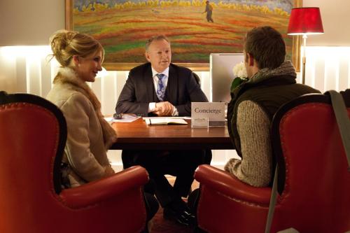 a man and two women sitting at a table at Sälens Högfjällshotell in  Högfjället