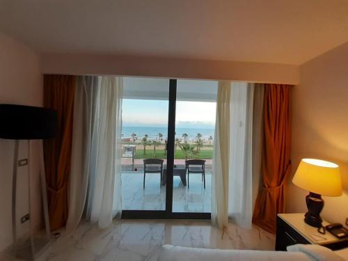 a hotel room with a view of the ocean at Porto Said Hotel & Spa in Port Said
