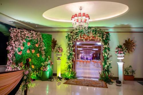 a room with a flower wall and a door at The Orchid Shimla in Shimla
