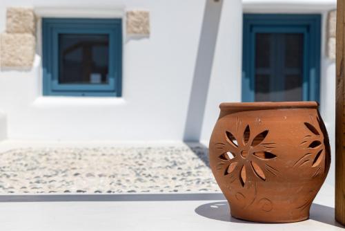 a brown vase sitting on top of a table at Blue Pearls-Adults Only Luxury Suites in Kos Town