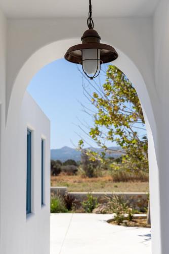 an archway with a light hanging from a building at Blue Pearls-Adults Only Luxury Suites in Kos Town