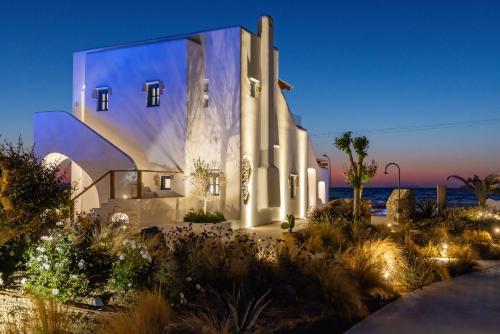 a large white building with lights on it at night at Blue Pearls-Adults Only Luxury Suites in Kos Town