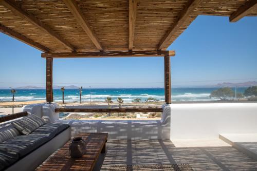 a living room with a view of the beach at Blue Pearls-Adults Only Luxury Suites in Kos Town