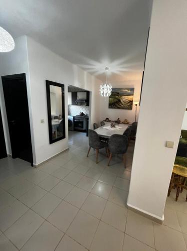 a dining room with a table and chairs in a room at La Vida Villa Alcudia Smir Fnideq, Holiday Homes in Tetouan
