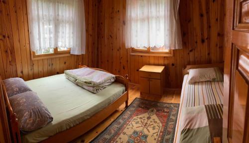 A bed or beds in a room at İnka Dağ Evi