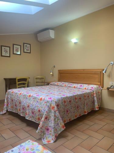 Postel nebo postele na pokoji v ubytování Agriturismo il Castello