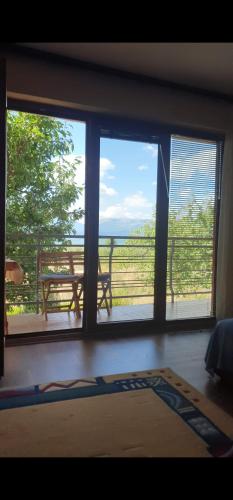 a room with a window with a view of the ocean at Villa Altiparmak in Resen