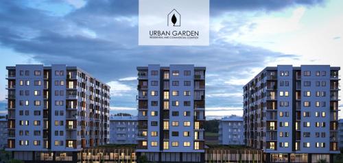 a rendering of two tall buildings in a city at Urban Garden APARTMENT in Skopje
