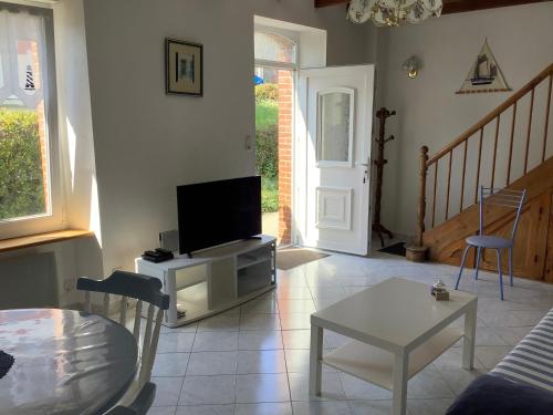 TV a/nebo společenská místnost v ubytování Le gite de la plage