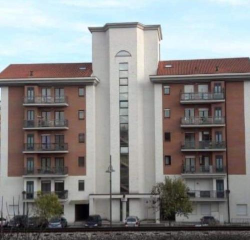 two buildings with cars parked in front of them at Artemide Residence in Isernia