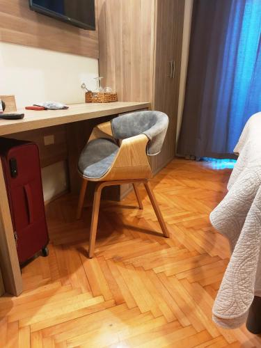 a chair sitting in front of a desk in a room at Villa B&B Marina & Parking Free in Rovinj