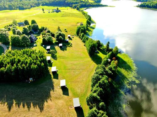 an island in the middle of a body of water at Atpūtas vieta Ežezers in Andzeļi