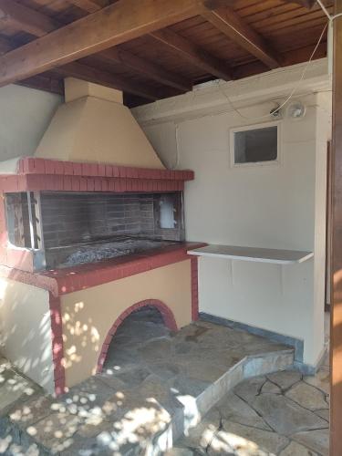 a model of a pizza oven in a house at La Casa De Vacation in Lafkos