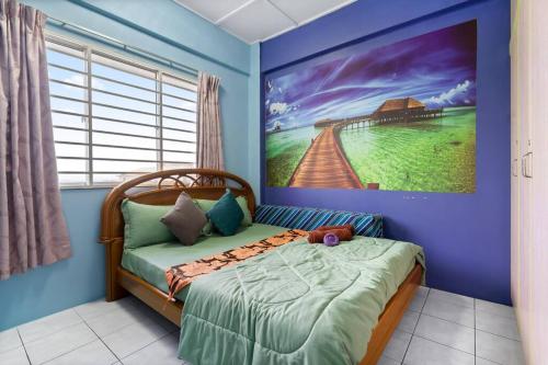 a bedroom with a bed with a painting on the wall at 2 scenic air cond bedrooms, 1 room ceiling fan, near Bandar Rawang in Rawang
