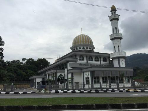 a building with a mosque with a gold dome on it at 2 scenic air cond bedrooms, 1 room ceiling fan, near Bandar Rawang in Rawang