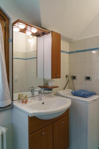 a bathroom with a sink and a mirror at La Casetta Varenna in Varenna