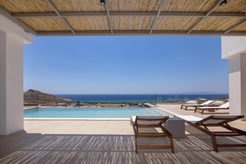 a view of a pool from the patio of a house at Blue Gres Villa Tinos in Tinos Town