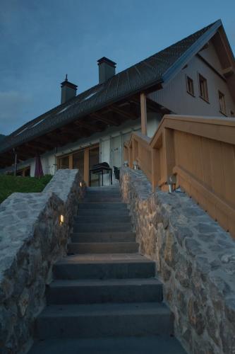 a set of stairs in front of a building at Holiday Home Planina in Tržič