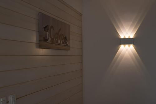 a light on a wall in a room at Holiday Home Planina in Tržič