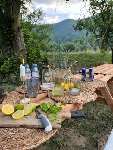 a picnic table with food and drinks on it at Hygge Cabana in Malaia