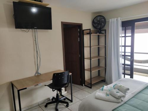 TV a/nebo společenská místnost v ubytování Pousada Praia do Calixto