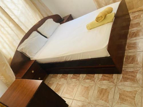 Ένα ή περισσότερα κρεβάτια σε δωμάτιο στο One World Village Guesthouse