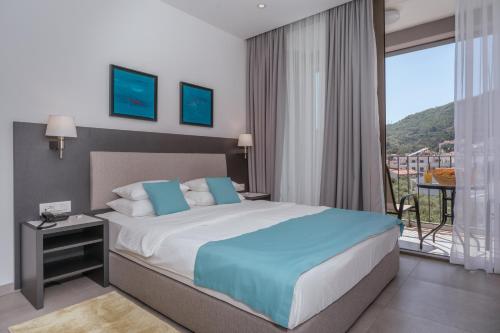 Postel nebo postele na pokoji v ubytování Hotel Eleven