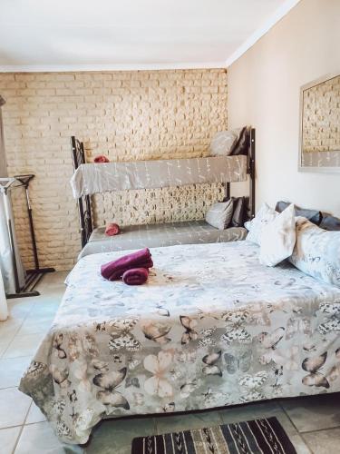 Postel nebo postele na pokoji v ubytování Ambiente Budget Accommodation