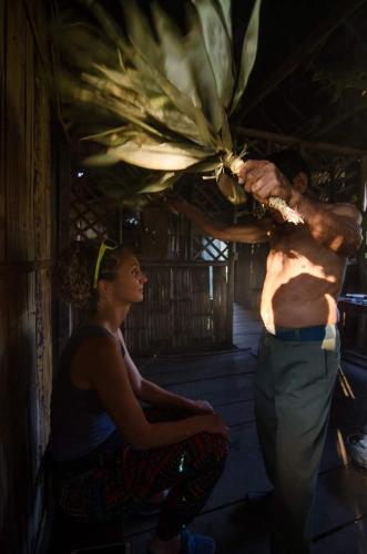 a man and a woman standing in a room at Grand Selva Lodge & Tours in Tena