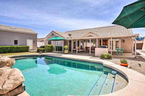 a swimming pool in front of a house at Private Tuscany Oasis with Pool - Perfect for families, couples or business travelers home in Phoenix