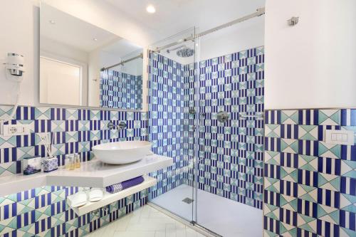 a bathroom with a sink and a shower at Relais 2 Pini in Anacapri