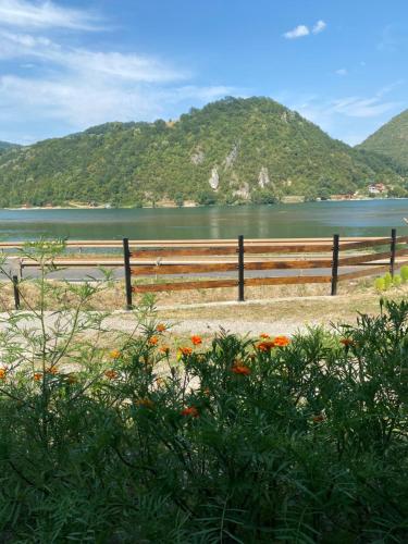 a wooden fence next to a body of water at Dijanin Konak in Zvornik