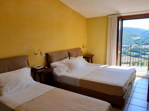 Postel nebo postele na pokoji v ubytování Hotel Brufa