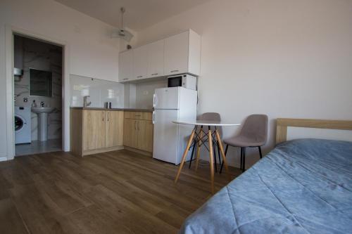 Kuchyň nebo kuchyňský kout v ubytování Sunset Cove Apartment