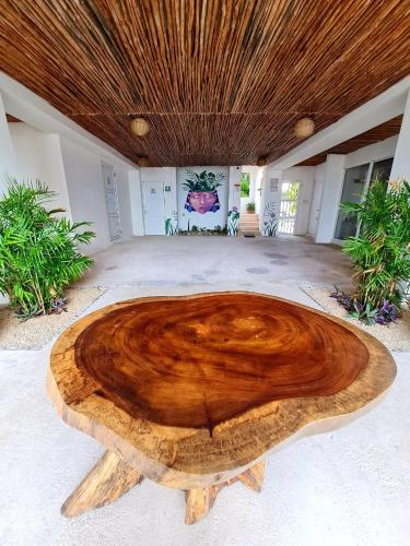 a wooden table in the middle of a room at Caribe Dream Private Beach in Mahahual