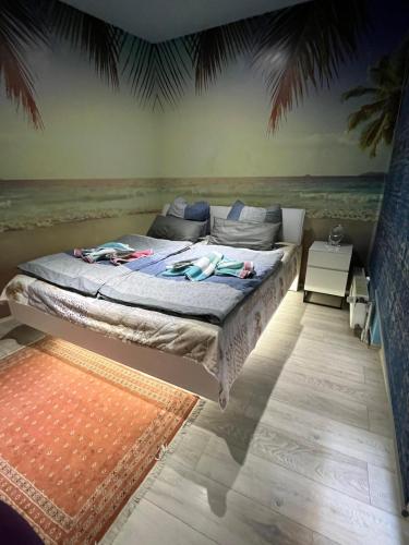 a bedroom with a bed with the ocean in the background at Luxury Gemütliche WOHNUNG in Eigelstein Köln in Cologne