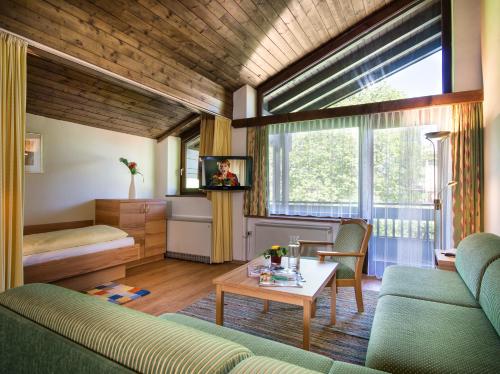En eller flere senger på et rom på Appartementhaus Gastein inklusive Alpentherme gratis