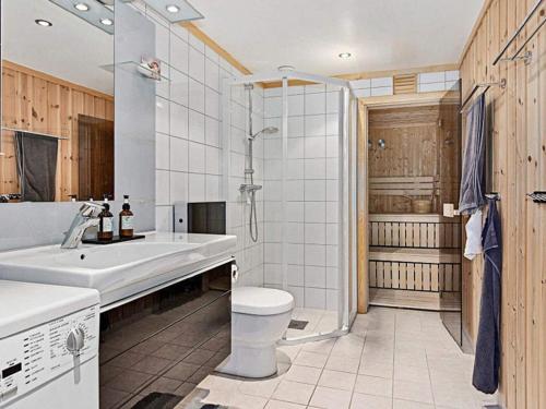 a bathroom with a sink and a toilet and a shower at 11 person holiday home in Noresund-By Traum in Noresund