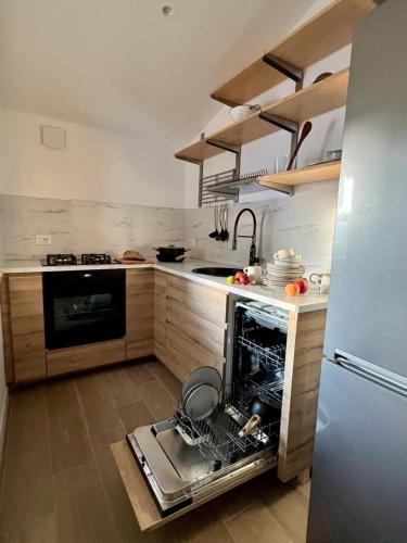 a kitchen with an oven in the middle of it at In-Experience in I Casoni