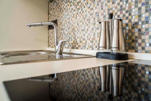 a kitchen counter with a sink and a faucet at Ve & Ki in Podstrana