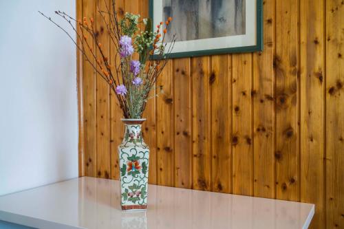 a vase with flowers in it sitting on a table at Ve & Ki in Podstrana