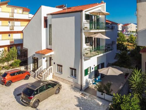 an orange car parked in front of a building at Ve & Ki in Podstrana